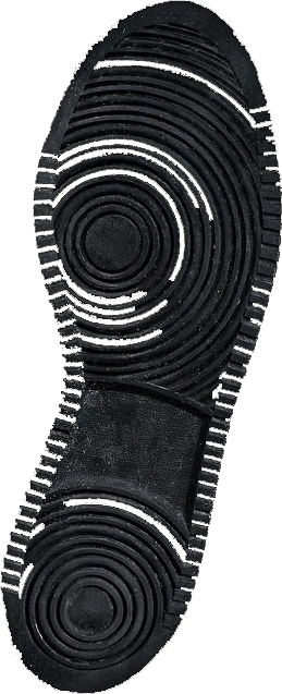 Shoe print pressed into sand